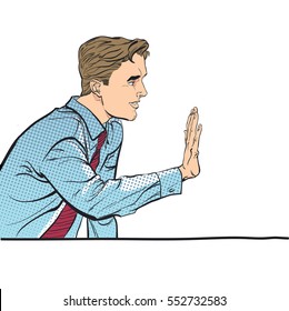 Sitting man stops someone. Man stopping someone. Man rejecting something. Forbidding man. Handsome young businessman giving stop signal. Concept idea of advertisement and promo. Halftone background.