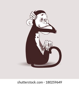 Sitting monkey hugged his head with his right hand
