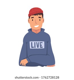 Sitting Smiling Young Man Looking at Us Cartoon Vector Illustration