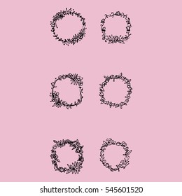Six black and white wreaths on pink background
