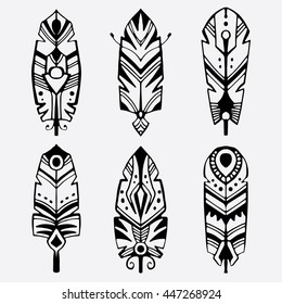 Six decorative bohemian style feathers. Abstract tribal feathers in a tattoo style. Vector illustration