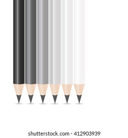 Six pencils of different shades of grey