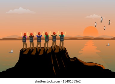  Six  people stood up and showed his hands on the top of the mountain happily. There are sea, mountains and sunset background