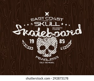 Skateboard skull emblem with shabby texture. Graphic design for t-shirt. White print on wood texture background