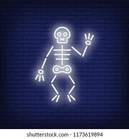 Skeleton neon icon. Terrifying Halloween zombie on brick wall background. All Hallows eve concept. Vector illustration can be used for street wall signs, party announcements, invitation