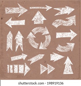 Sketch arrow collection on brown parcel paper for your design. Vector illustration. 