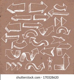 Sketch arrow collection for your design. Hand drawn on brown paper. Vector illustration. 