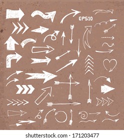 Sketch arrow collection for your design. Hand drawn on brown paper. Vector illustration.