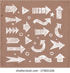 Sketch arrow collection for your design. Hand drawn on brown paper. Vector sketch illustration. 