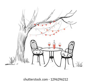 
Sketch of the celebration of Valentine's Day outdoors.
Tree with garlands of light bulbs and hearts.Two forged chairs with cushions,round table, bottle of rose wine and two glasses. Vector  .