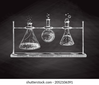 Sketch of chemical laboratory objects. Glassware for a chemical experiment on a chalk board. Vector pharmaceutical flasks, beakers and test tubes. Discovery and chemistry symbol.