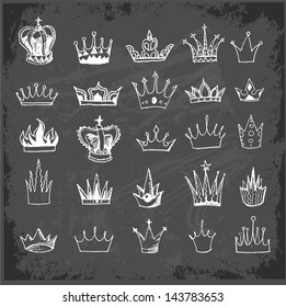 Sketch crowns collection on blackboard. Vector illustration.