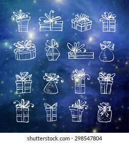 Sketch gift boxes collection on blurred glowing blue background. Elements of this image furnished by NASA. 