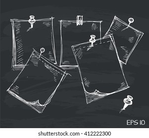 sketch note papers with pushpins on black board