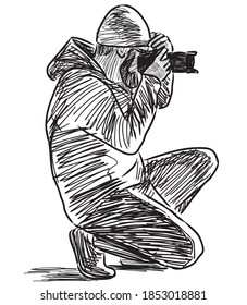 Sketch Of Photographer Crouching And Taking Picture