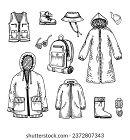 Sketch set clothes for hiking trip. Travel to forest, mountains. Hand drawn line art.