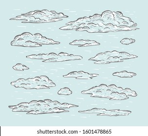 Sketch set of hand drawn clouds isolated on blue background. Design elements. Vector illustration