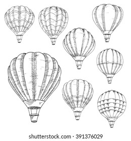 Sketched flying hot air balloons in vintage engraving style with lush envelopes. Air transportation, hobby, romantic weekend, travel design usage