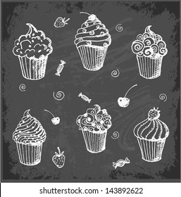 Sketches of cupcakes on blackboard. Vector illustration.