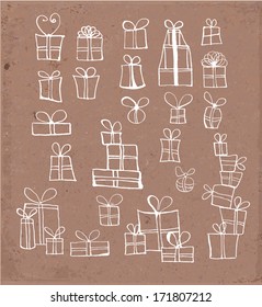Sketches of gift boxes hand drawn on brown paper. Vector illustration.