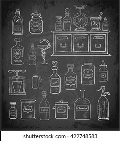 Sketches of vintage drugstore objects on blackboard background. Pharmacy bottles, mortar and pestle, old apothecary cabinet, scales etc. 
