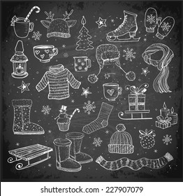 Sketches of winter elements on blackboard: boots, warm clothes, lantern, scarf, sleigh and others.