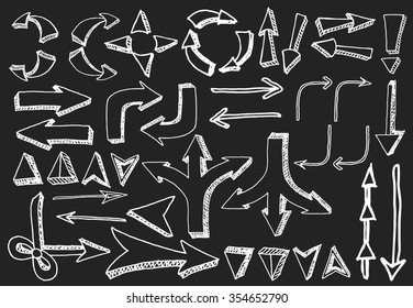 Sketchy arrows on black background. Freehand drawn. Vector illustration.