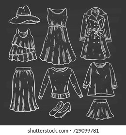 sketchy or hand drawn woman fashion clothing on chalkboard background