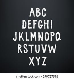 Sketchy rough alphabet on blackboard background. Hand drawn uppercase letters.
