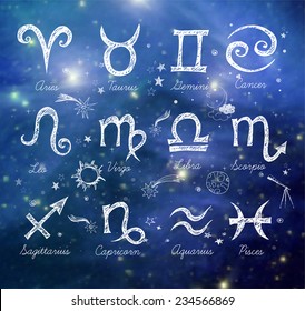 Sketchy zodiac symbols hand-drawn with ink on blurred glowing background. Elements of this image furnished by NASA. 