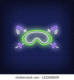 Ski goggles and sticks neon sign. Ski resort, winter sport and advertisement design. Night bright neon sign, colorful billboard, light banner. Vector illustration in neon style.