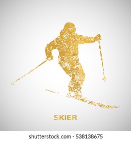 A skier from gold particles. Silhouette of the skier is composed of small abstract forms of gold. Vector image
