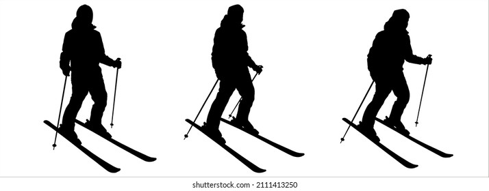 El esquiador empuja el suelo con los postes de esquí para avanzar. Deportes de invierno. Hombre, esquiador. El esquiador se prepara para descender de la pendiente.  Tres siluetas negras macho aisladas sobre fondo blanco.