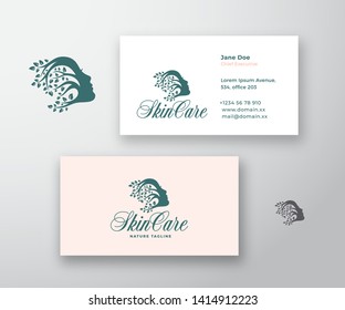 Skin Care Logo and Business Card Template. Beautiful Woman Face with Curly Hair of Branches with Leafs. Premium Stationary Realistic Mock Up. Isolated.