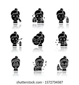 Skin care procedures drop shadow black glyph icons set. Night time routine. Applying undereye cream. Sheet cotton mask. Spot treatment. Hydrogel patches. Vitamin C serum. Isolated vector illustrations