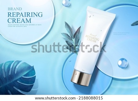Skin repairing cream ad in 3d. Tube product on round glass discs with plant leaves and dewdrop on blue background. 商業照片 © 