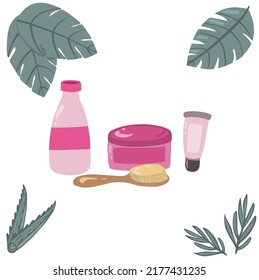 skincare tubes with brush and tropical leaves
