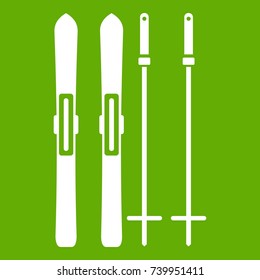 Skis and ski poles icon white isolated on green background. Vector illustration