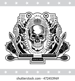 Skull front view in center of oval wreath between torch and arrows. Heraldic vintage label on white