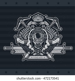 Skull front view in center wreath with crossbow and sword. Heraldic vintage label on blackboard
