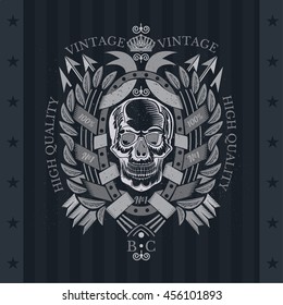 Skull front view with a lower jaw in center oval frame between wreath and cross arrows. Heraldic vintage label on blackboard