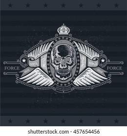 Skull front view with a lower jaw between two pair wings and ribbons. Vintage label isolated on blackboard
