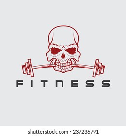 skull holding barbell in the teeth