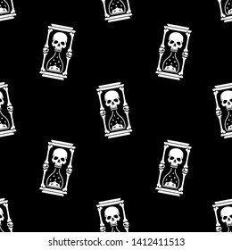 Skull and hourglass seamless pattern