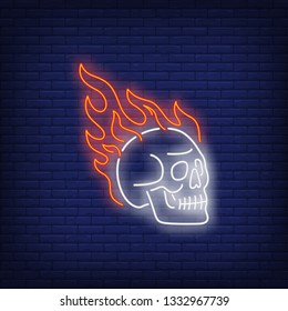 Skull on fire neon sign. Tattoo or logo design. Night bright neon sign, colorful billboard, light banner. Vector illustration in neon style.