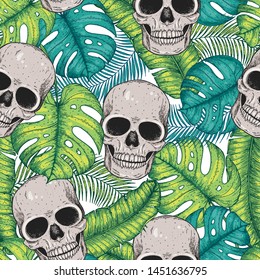 Skull and palm leaves seamless pattern. Hand drawn vector illustration. Fabric design template. Skull background. Tropical vector illustration.