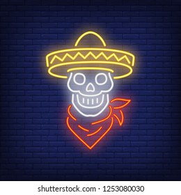 Skull in sombrero with neck scarf neon sign. Mexican culture design. Night bright neon sign, colorful billboard, light banner. Vector illustration in neon style.