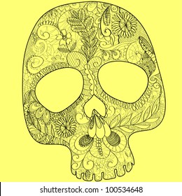 skull, woven out of black lace on yellow background