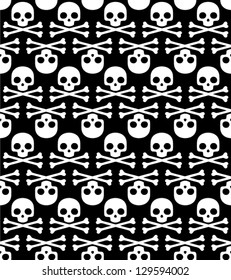 Skulls on black seamless background