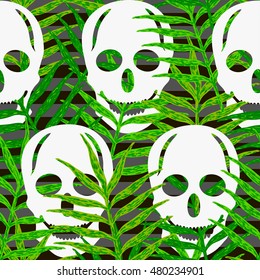 Skulls seamless pattern with green leaves. Halloween background